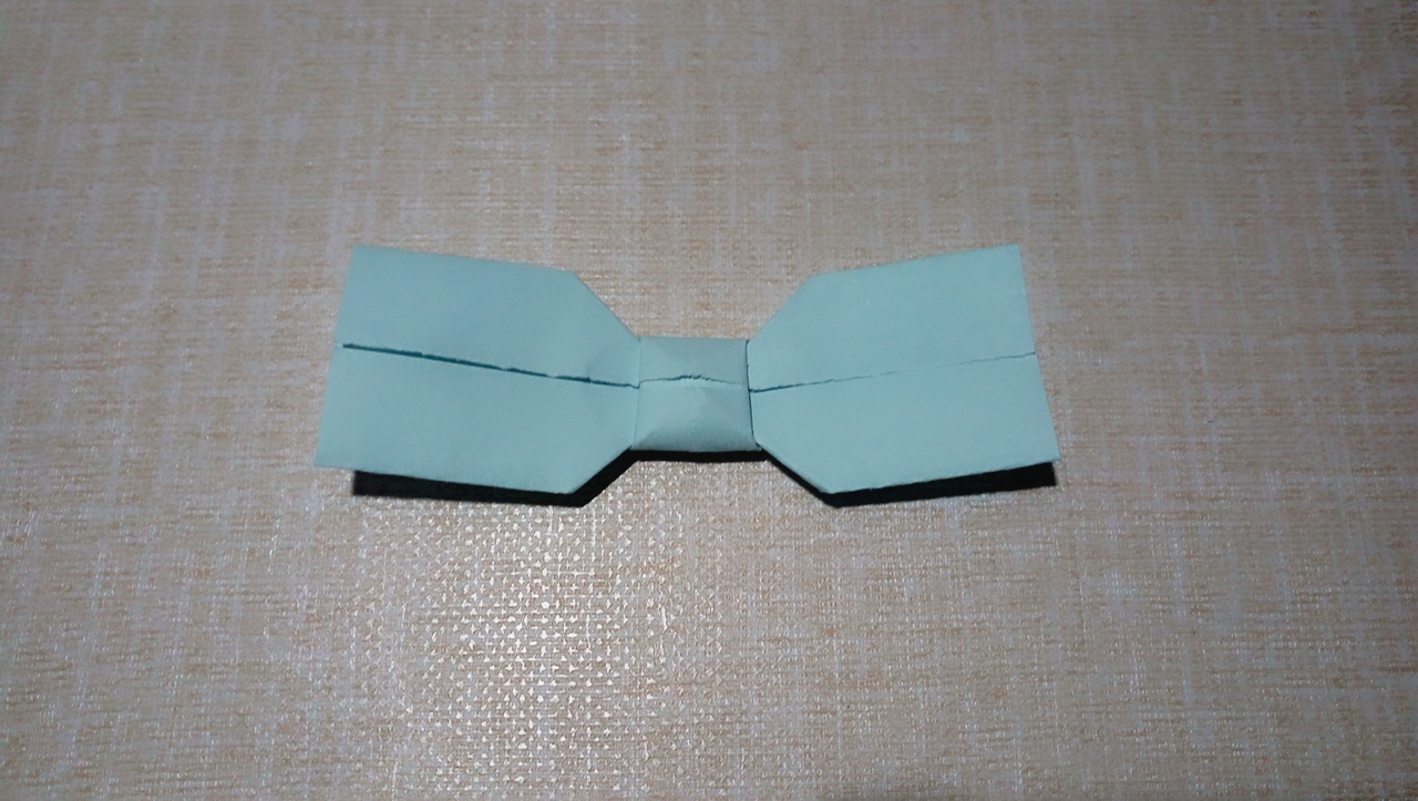 儿童折纸简单手工幼儿园蝴蝶结,蝴蝶结手工折纸超简单正方形纸