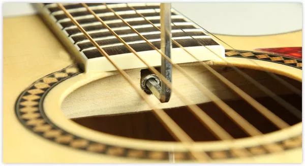 琴弦过高如何调节？