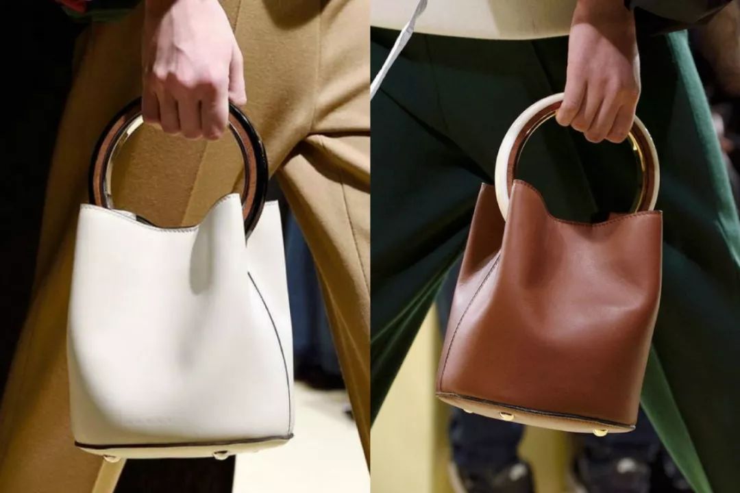 会背水桶包的人,会背奢侈品包包